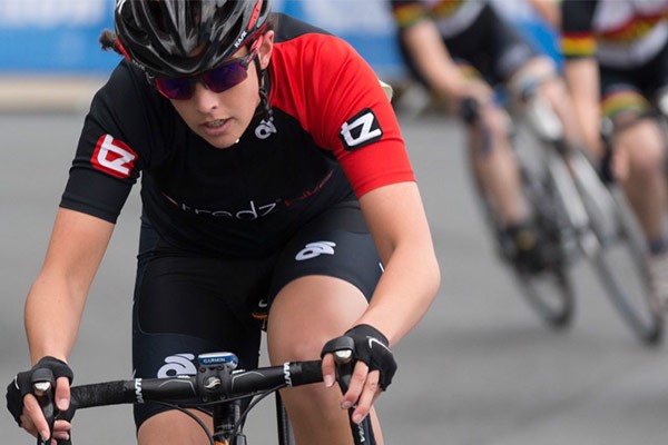 Close up of team tredz rider Danni in action on a road bike